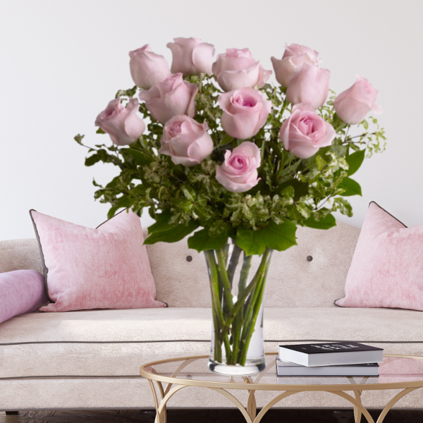 "dozen pink roses in vase"